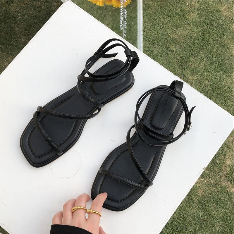 SUOJIALUN New Fashion Women Sandals Flat Heel Narrow Band Back Strap Summer Gladiator Shoes Ladies Casual Summer Beach Slides